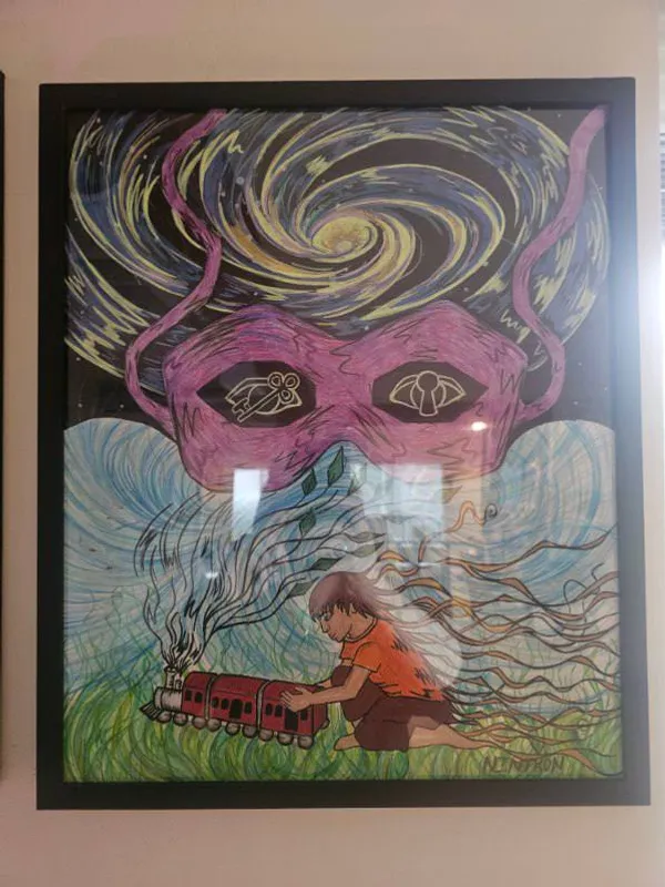 A surreal masked figure with swirling cosmic hair looms over a child playing with a toy train